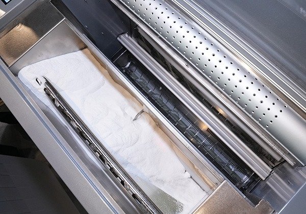 Vibration powder removal device